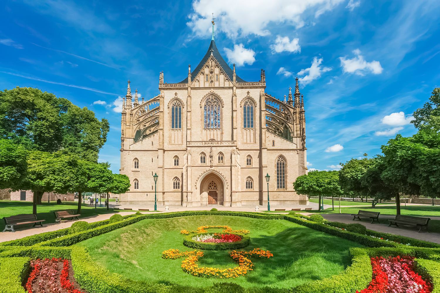 St. Barbara's Cathedral facade framed by its formal garden